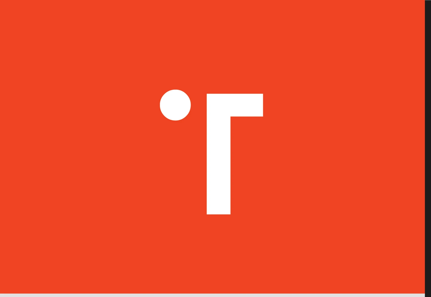 White T symbol on orange field